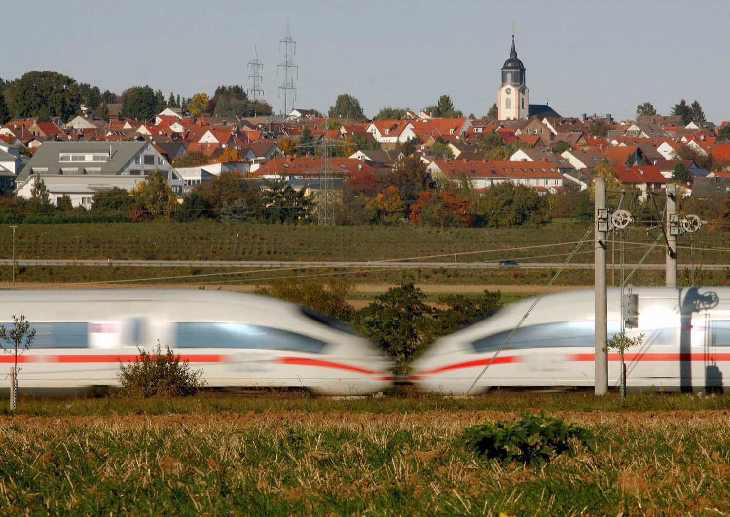 High-speed trains passing at speed in open country